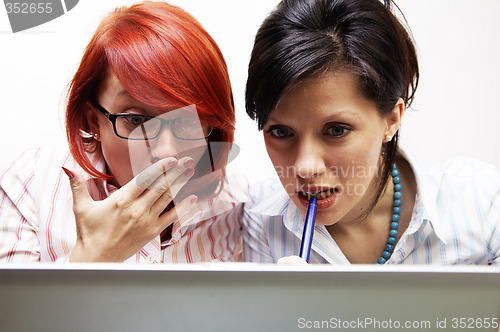 Image of Two businesswomen are very surprised