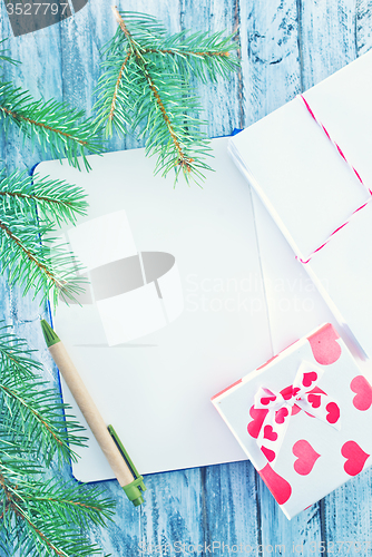 Image of notebook and christmas decoration