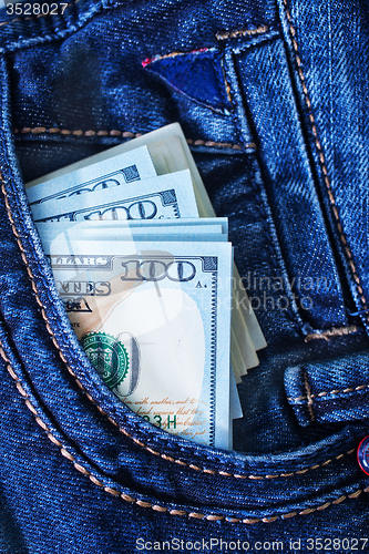 Image of dollars in jeans pocket