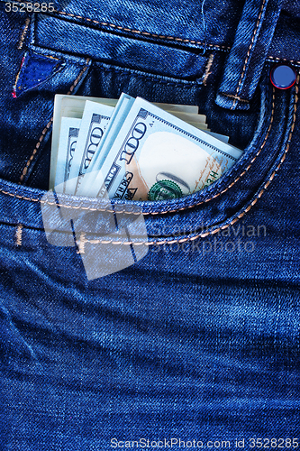 Image of dollars in jeans pocket