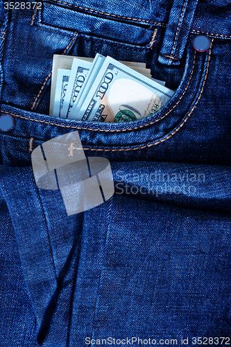 Image of dollars in jeans pocket