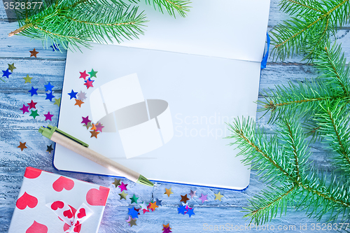 Image of notebook and christmas decoration