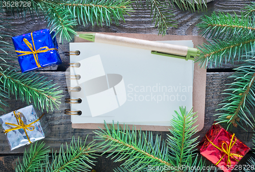 Image of notebook and christmas decoration