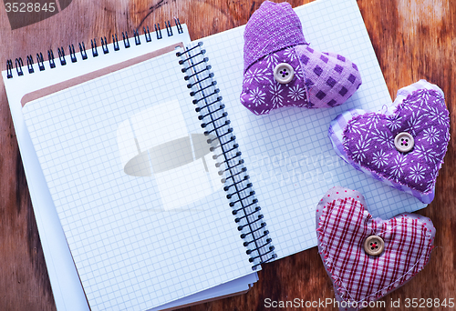 Image of hearts and notebook