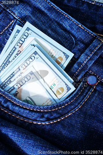 Image of dollars in jeans pocket