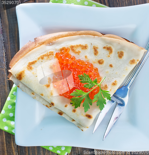 Image of pancakes with salmon caviar