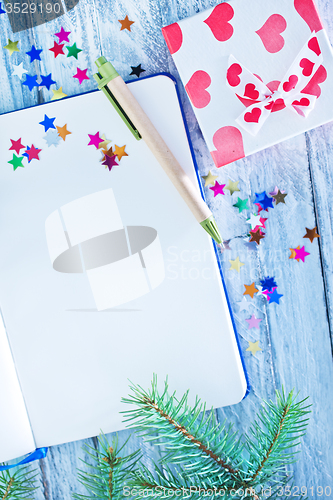Image of notebook and christmas decoration