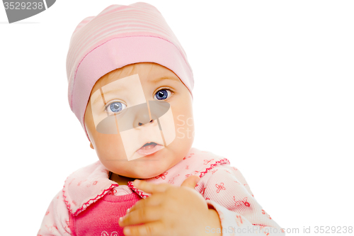 Image of baby girl in a pink dress and hat. Portrait. Studio. Isolated.