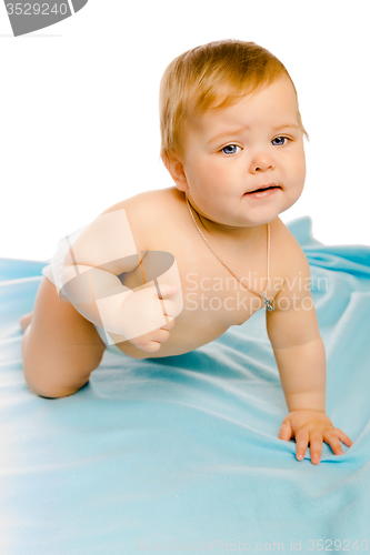 Image of upset baby in diapers. Studio