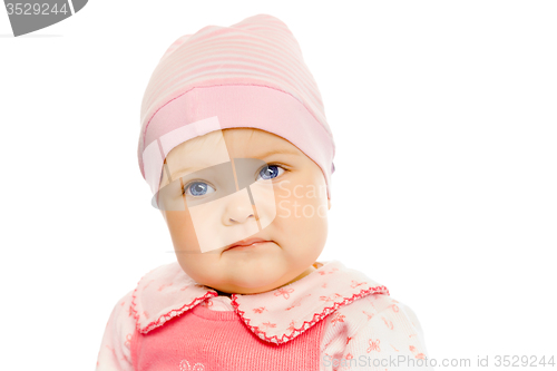 Image of baby girl in a pink dress and hat. Portrait. Studio. Isolated.