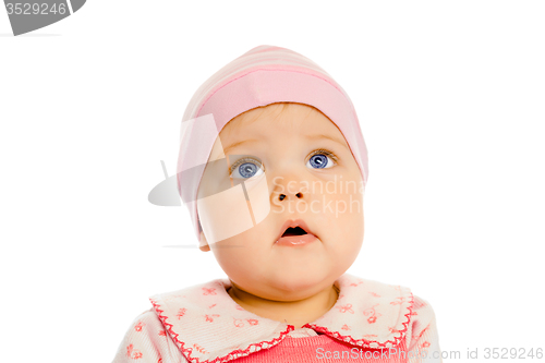 Image of baby girl in a pink dress and hat. Portrait. Studio. Isolated.