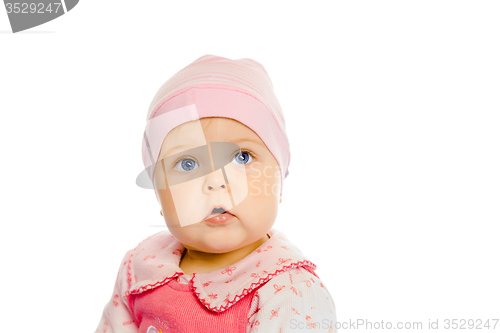 Image of baby girl in a pink dress and hat. Portrait. Studio. Isolated.