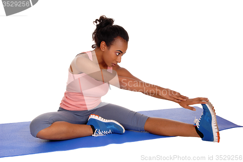 Image of Beautiful african american woman stretching.