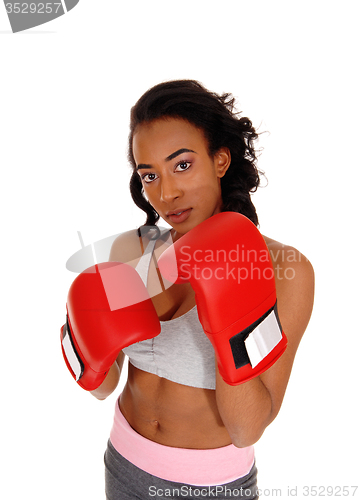 Image of African american woman wearing boxing gloves.