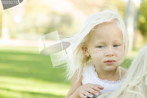 Image of Meloncholy Portrait of Cute Little Girl Outside