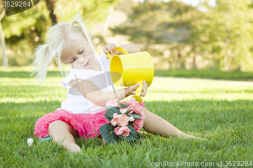 Image of Little Girl Playing Gardener with Her Tools and Flower Pot