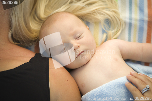 Image of Cute Baby Boy Laying Next to His Mommy on Blanket