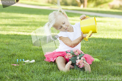 Image of Little Girl Playing Gardener with Her Tools and Flower Pot