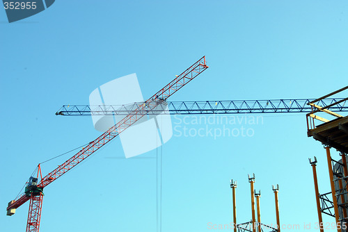 Image of two build cranes