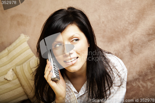 Image of young woman is speaking on cell phone