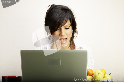 Image of beautiful caucasian woman with laptop singing