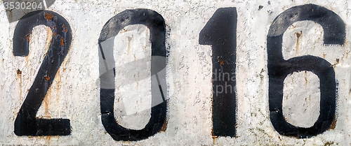Image of Rusty metal plate with numbers 