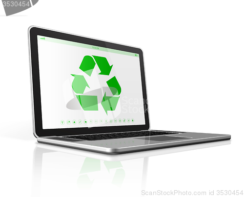 Image of Laptop computer with a recycling symbol on screen. environmental