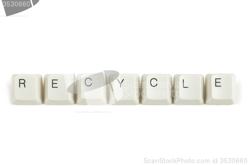 Image of recycle from scattered keyboard keys on white