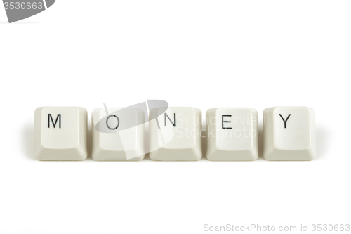 Image of money from scattered keyboard keys on white