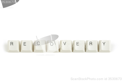 Image of recovery from scattered keyboard keys on white