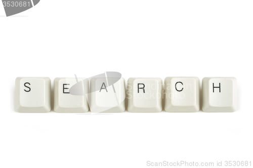 Image of search from scattered keyboard keys on white