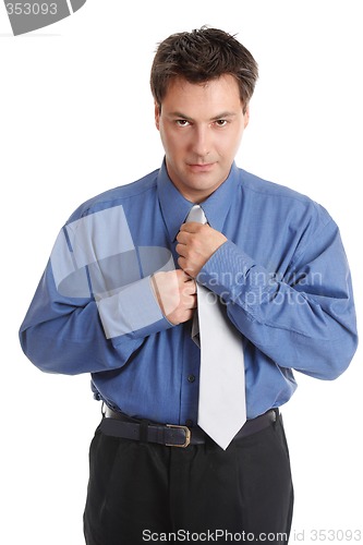 Image of Businessman getting dressed