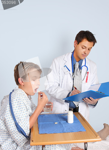 Image of Doctor gives patient medication