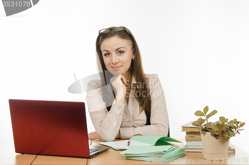 Image of Portrait of a teacher at his desk