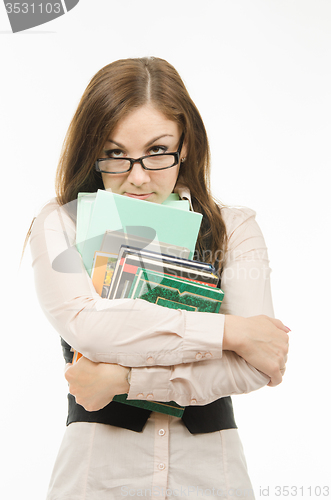 Image of Strict teacher with books and notebooks