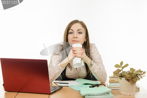 Image of Tired teacher with a notebook in hands