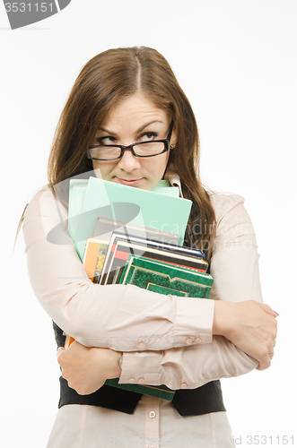 Image of Dodgy teacher with textbooks and notebooks