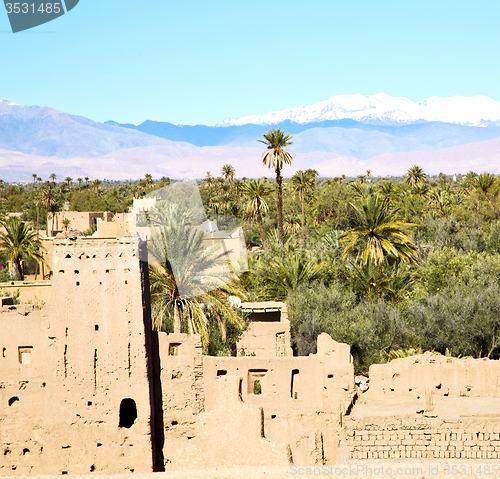 Image of brown  tower  old  construction in  africa morocco and  clouds  