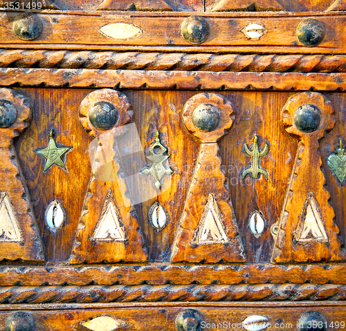 Image of shell  brown  rusty      morocco in africa the old wood  facade 