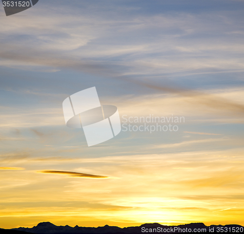 Image of sunrise in the colored sky white soft clouds and abstract backgr