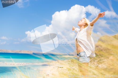 Image of Free Happy Woman Enjoying Sun on Vacations.