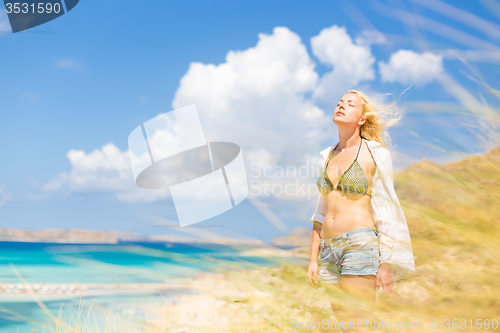 Image of Free Happy Woman Enjoying Sun on Vacations.