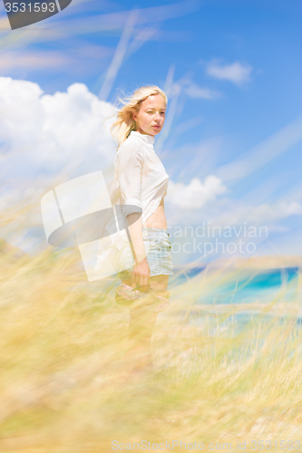 Image of Free Happy Woman Enjoying Sun on Vacations.