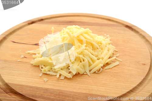 Image of Grated cheese on a wooden board