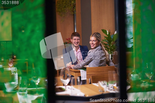 Image of business couple having dinner