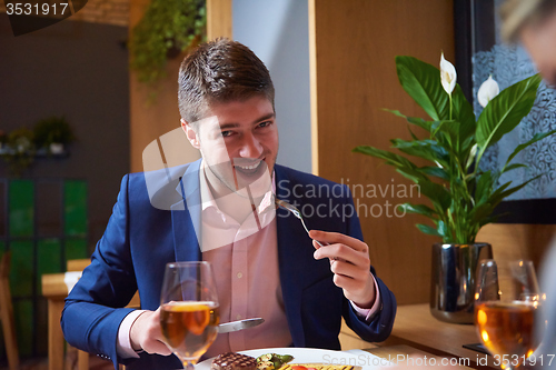 Image of business couple having dinner