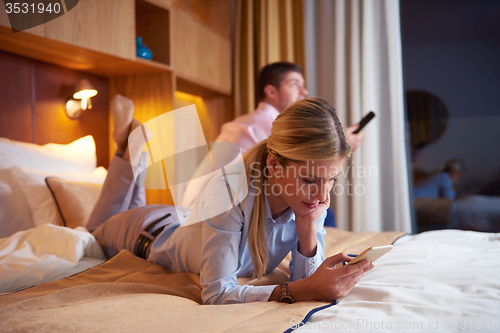 Image of young couple in modern hotel room