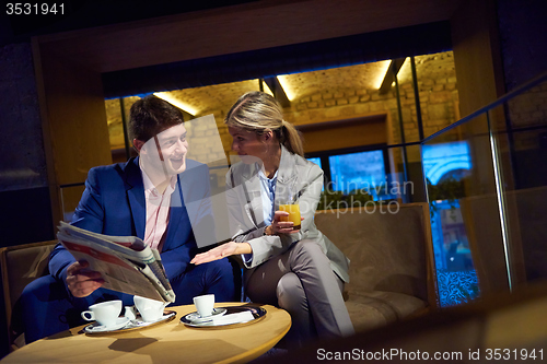 Image of business couple take drink after work