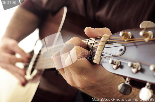 Image of Man playing a guitar