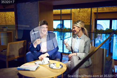 Image of business couple take drink after work